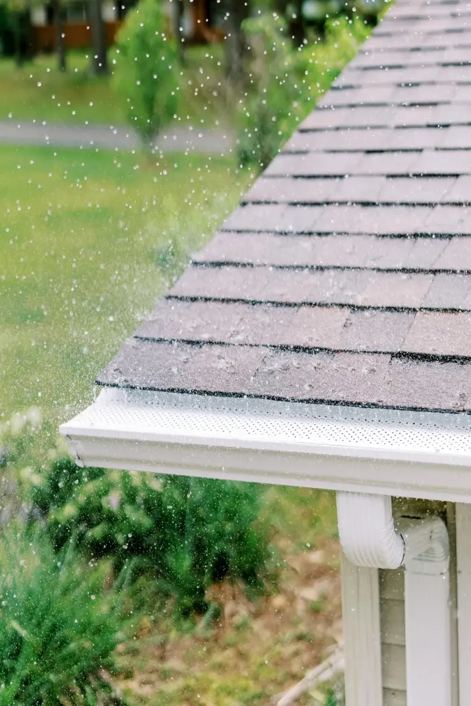 ValleyRoofingExteriors_May2021_Web077 Gutter guards protecting a home from water damage during the rain.