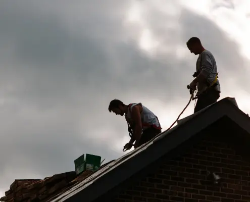 workers installing roof