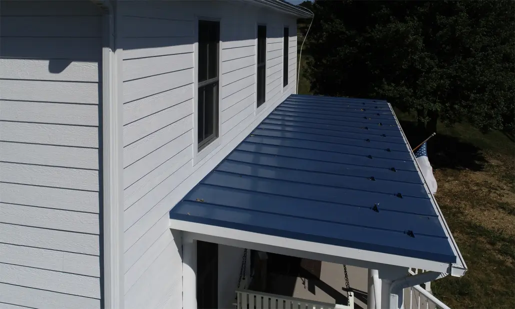 closeup of vinyl siding and metal roofing