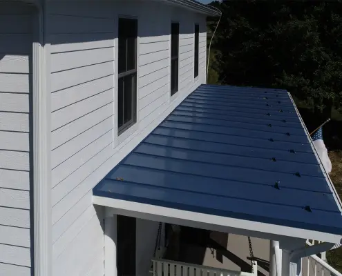 closeup of vinyl siding and metal roofing