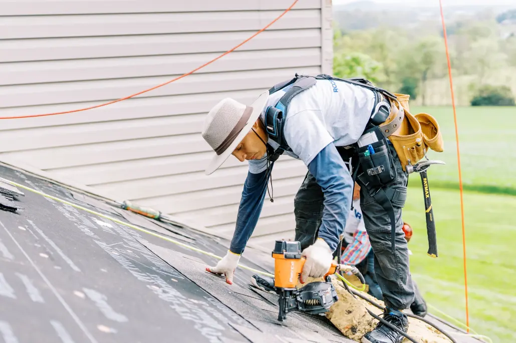 Roofer undertaking roof repair