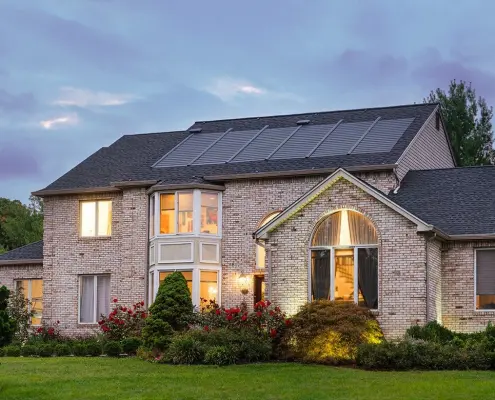 front exterior of home with timberline solar shingles on roof.