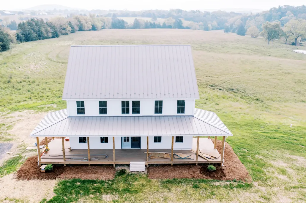 ValleyRoofingExteriors_May2021_Web162 aerial view of home with metal roofing.
