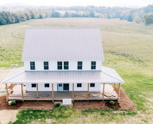 aerial view of home with metal roofing.