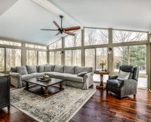 Interior of a fully furnished sunroom.