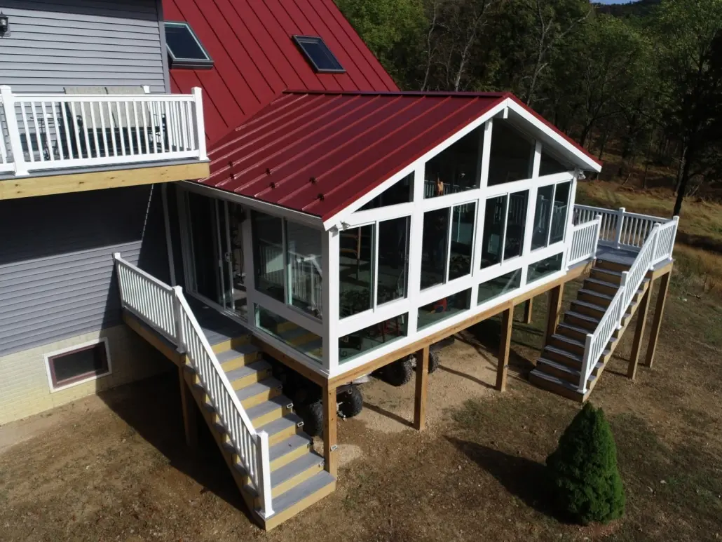sunroom with red metal roof
