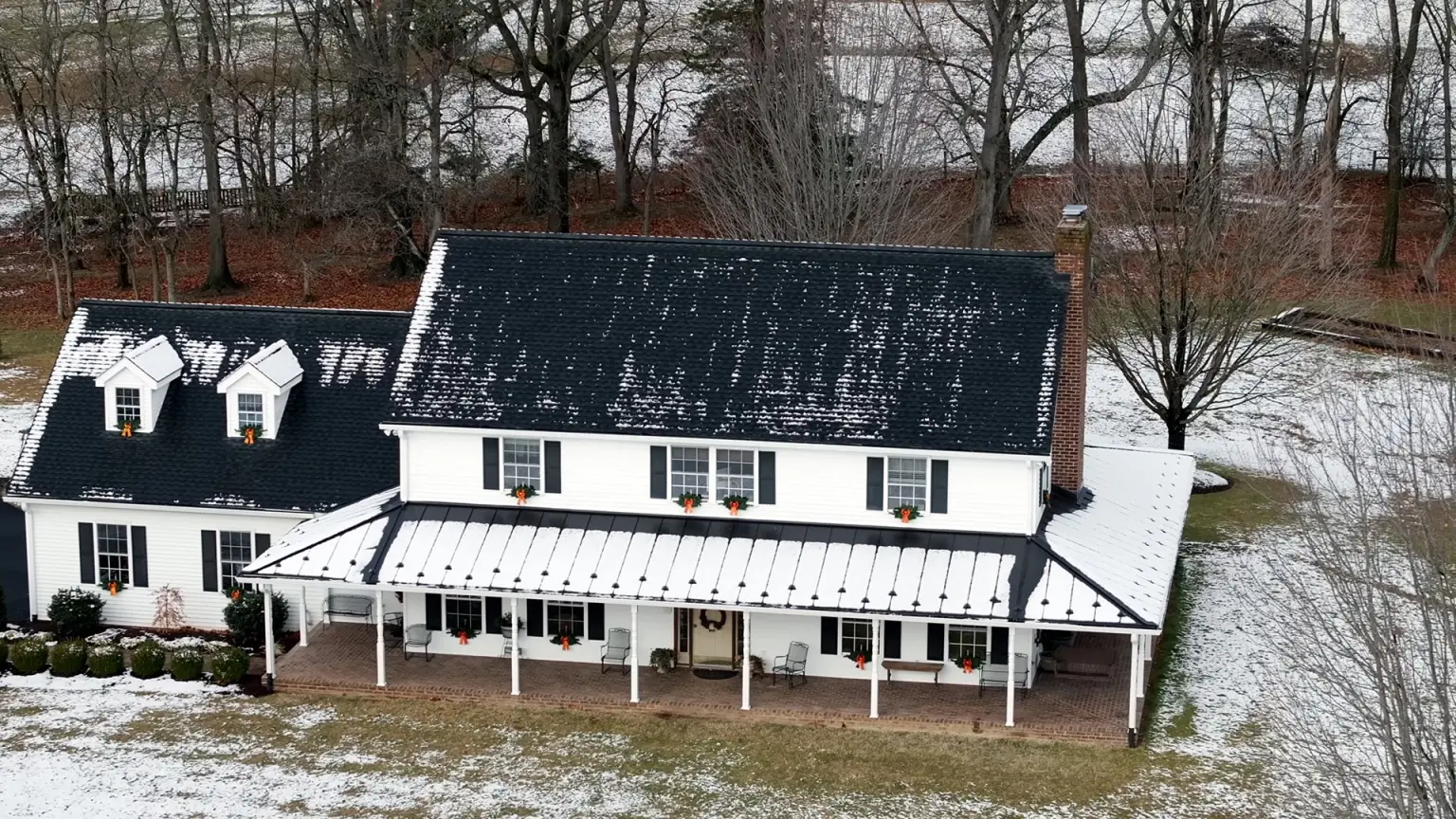Whole Home aerial view of Halterman's new roof and metal roof on porch
