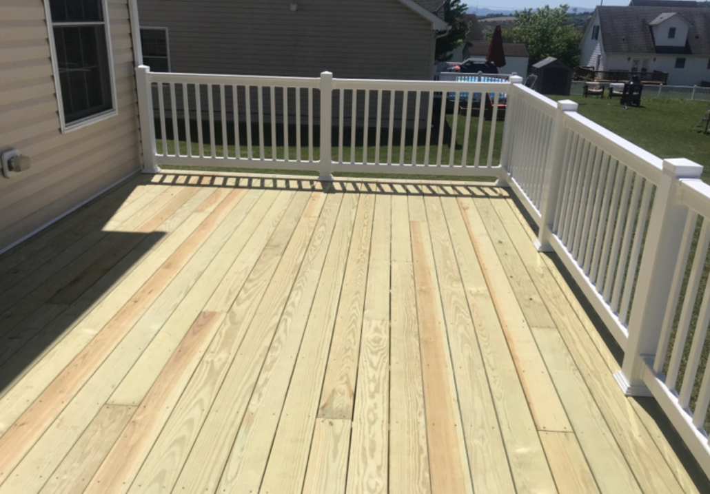 Pressure-Treated Wood Backyard Deck Pressure-Treated Wood Backyard Deck with vinyl railing
