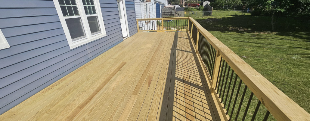 Pressure-treated deck Pressure-treated deck with wood railing