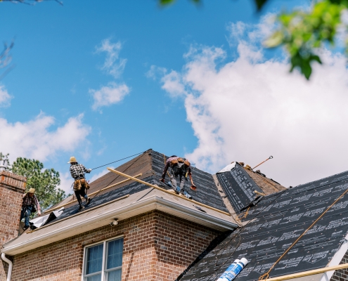 Valley Roofing & Exteriors roofers working
