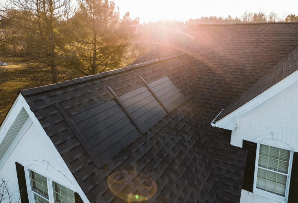 a bird's eye view of top of a residential roof with timberline solar roof shingles.
