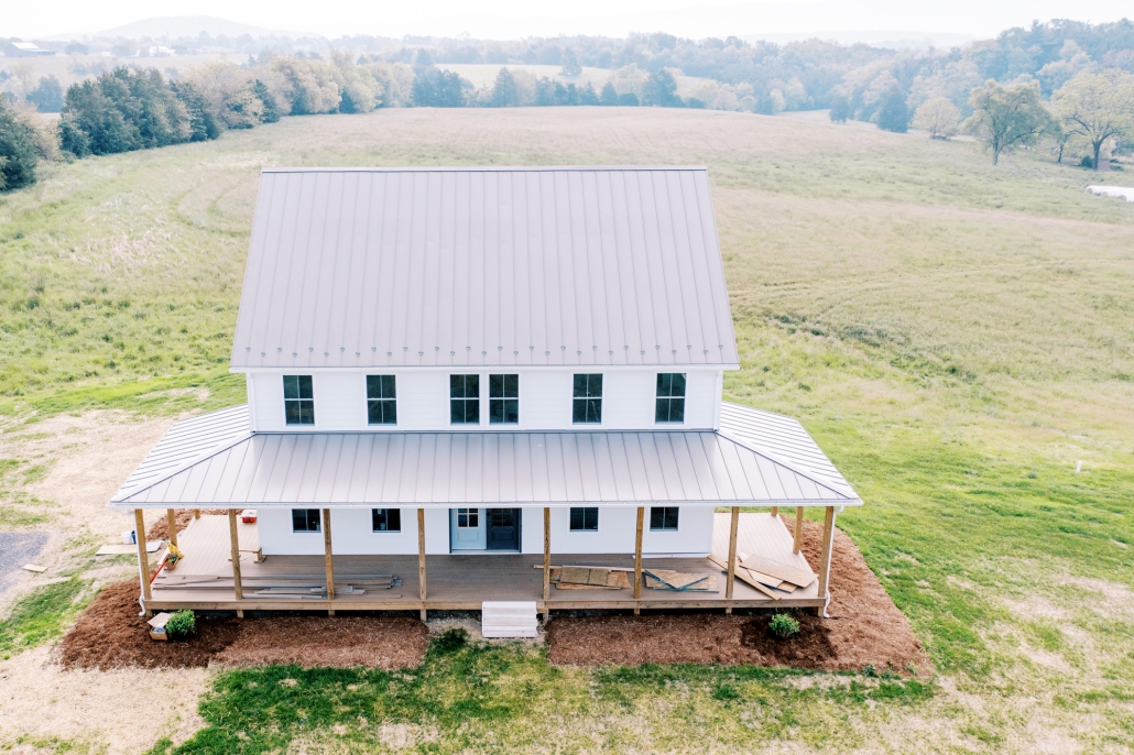 aerial view of home with metal roofing.