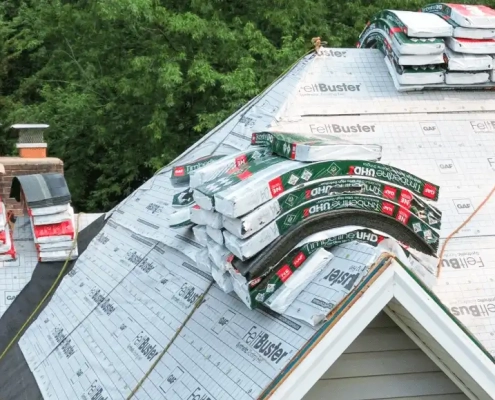 Valley-Roofing-14-1-1030x579 Stacks of GAF materials stacked on top of residential roof mid-way through installation