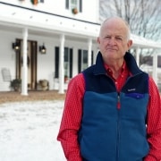 Homeowner, Dick Halterman, standing in front of his home.
