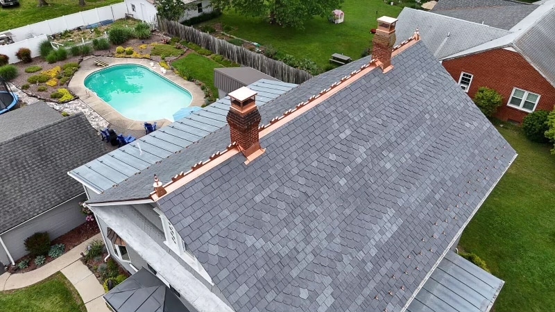 Custom-cut slate roof with copper detailing in Bridgewater, VA.