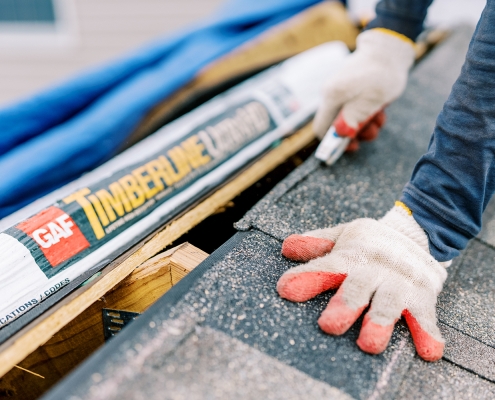 Close up of GAF Timberline roofing shingles being installed
